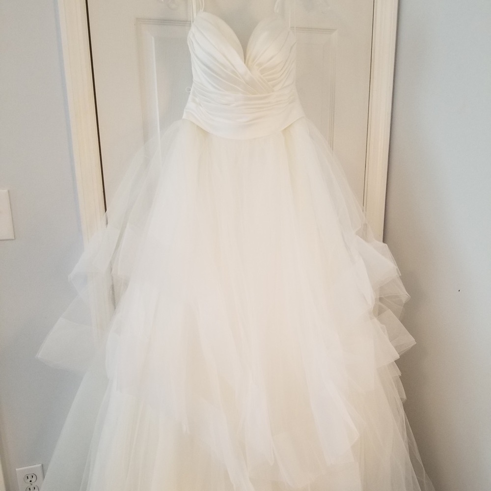 Size 12 wedding dress that has never been worn.